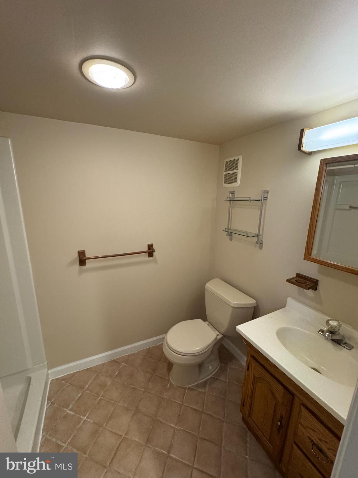 251 Revere Road Clifton Heights, PA 19018 - Photo 15 of 23 a bathroom with a sink a toilet and a mirror