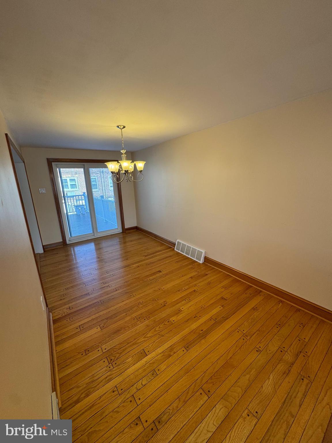 251 Revere Road Clifton Heights, PA 19018 - Photo 3 of 23 an empty room with wooden floor and windows