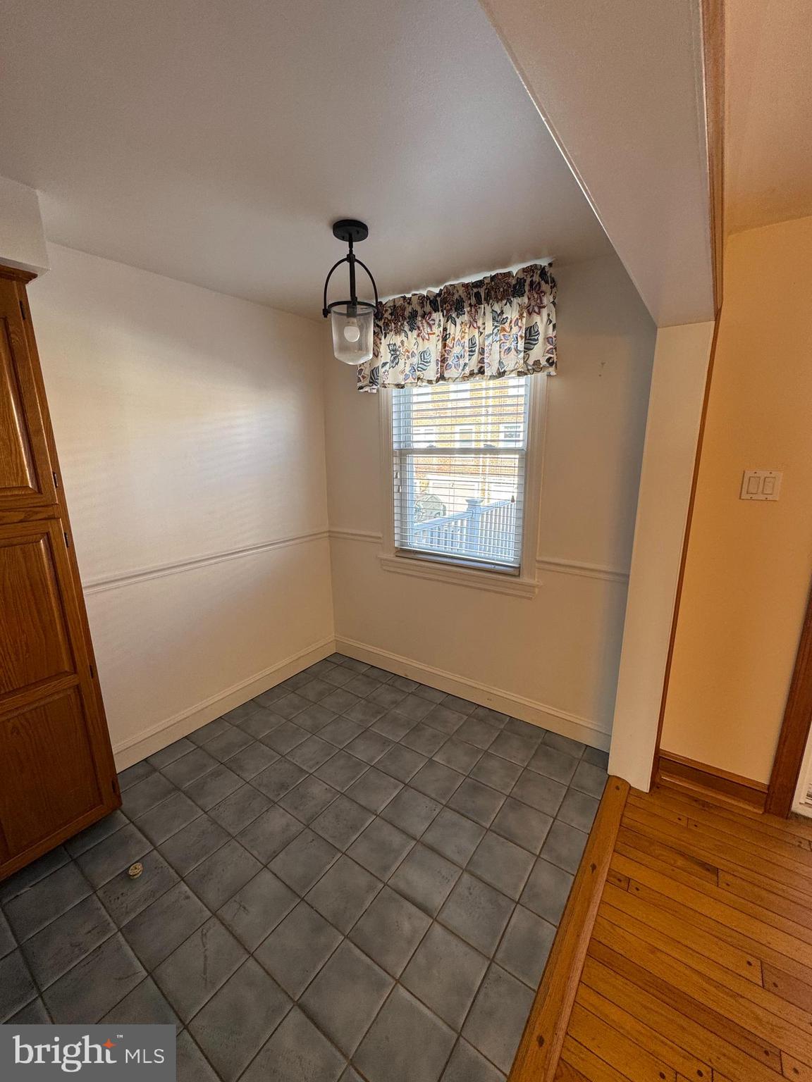 251 Revere Road Clifton Heights, PA 19018 - Photo 4 of 23 an empty room with wooden floor and windows