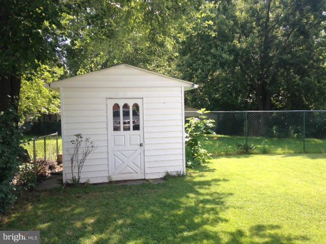 5435 Whitfield Chapel Road Lanham, MD 20706 - Photo 14 of 16 a view of a house with a yard