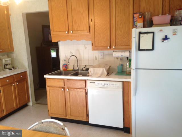 5435 Whitfield Chapel Road Lanham, MD 20706 - Photo 4 of 16 a kitchen with cabinets and appliances