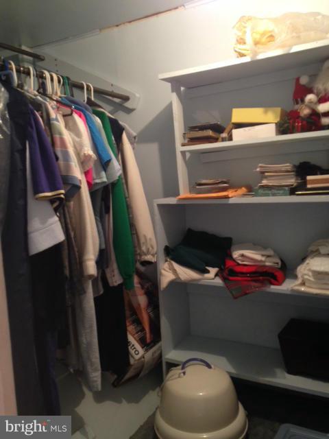 5435 Whitfield Chapel Road Lanham, MD 20706 - Photo 7 of 16 a view of walk in closet with clothes and shoes