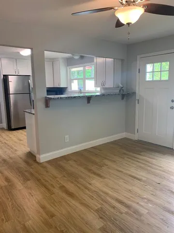 a view of a kitchen with a sink and a window