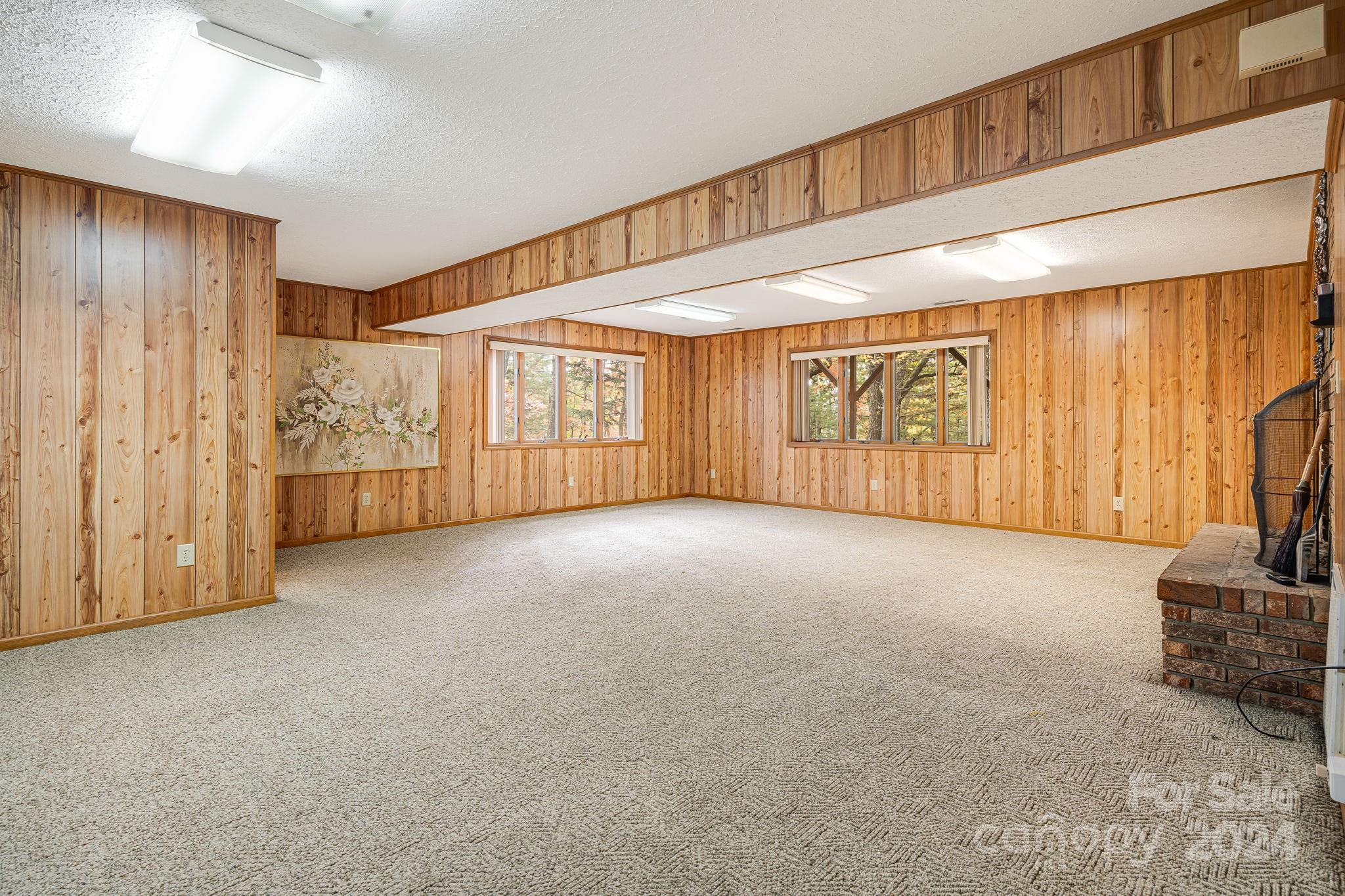 56 Whitaker View Road Fairview, NC 28730 - Photo 28 of 34 a view of an empty room with a fireplace