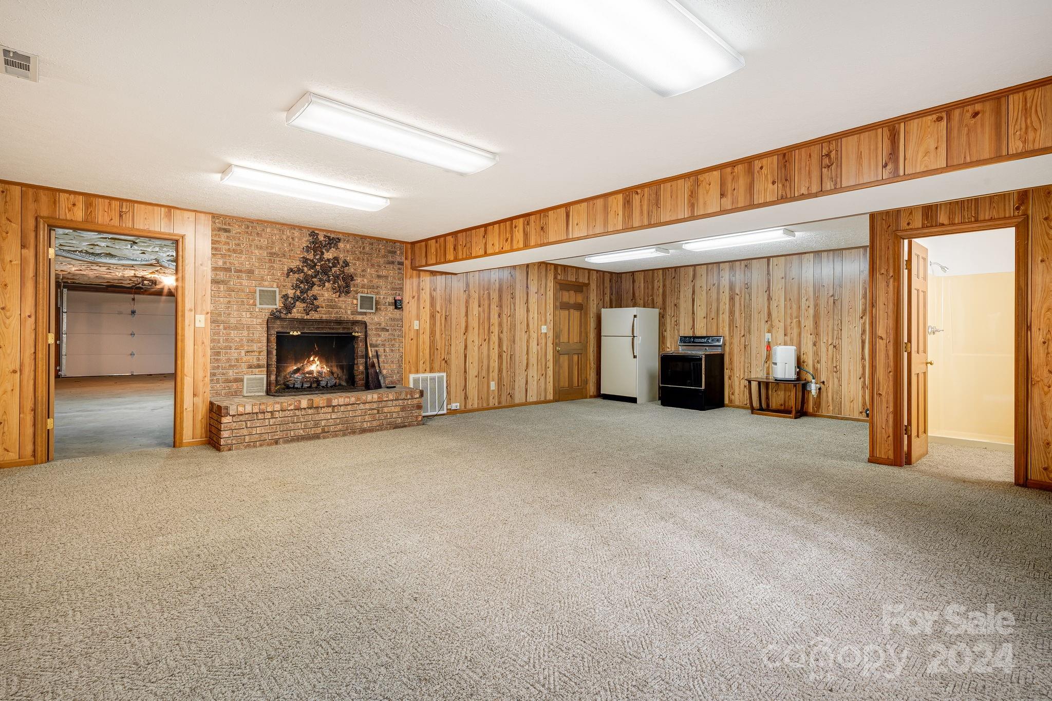 56 Whitaker View Road Fairview, NC 28730 - Photo 29 of 34 a view of empty room with a fireplace