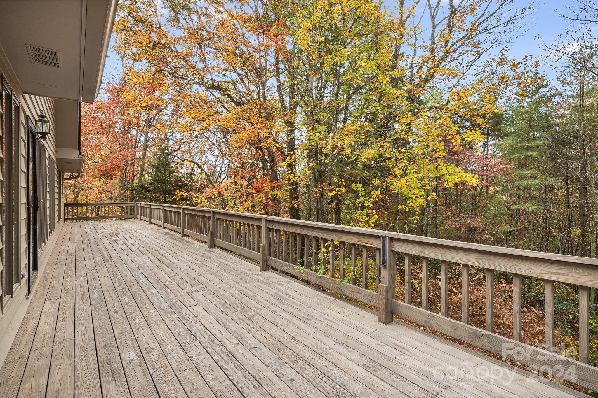 56 Whitaker View Road Fairview, NC 28730 - Photo 3 of 34 a view of balcony with wooden floor and fence
