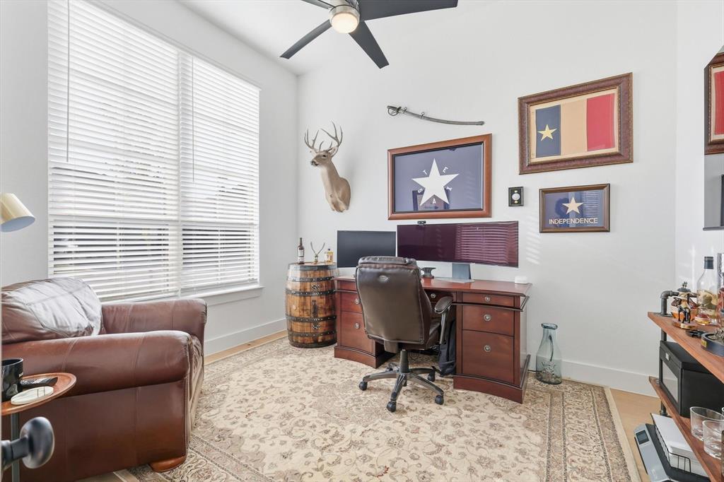 4608 Mount Vista Road Oak Point, TX 75068 - Photo 6 of 39 Dedicated office space featuring high ceilings, large windows with blinds, wood-finish flooring, and a ceiling fan