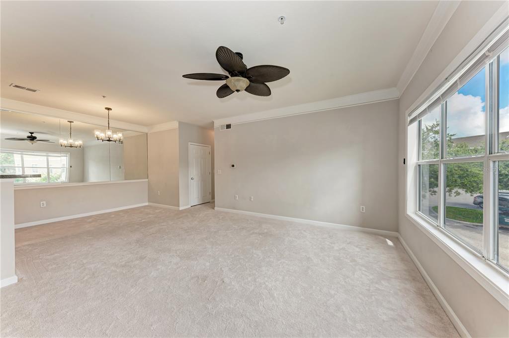 4802 51st Street West, Unit 1122 Bradenton, FL 34210 - Photo 11 of 37 a view of an empty room with a window