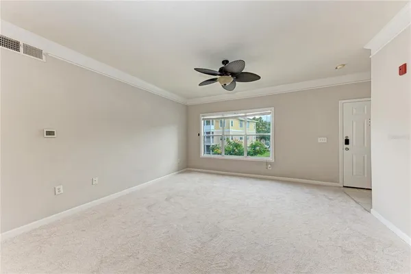 a view of an empty room with a window