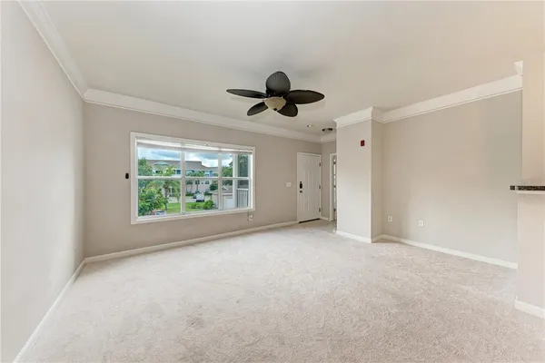 a view of an empty room with a window