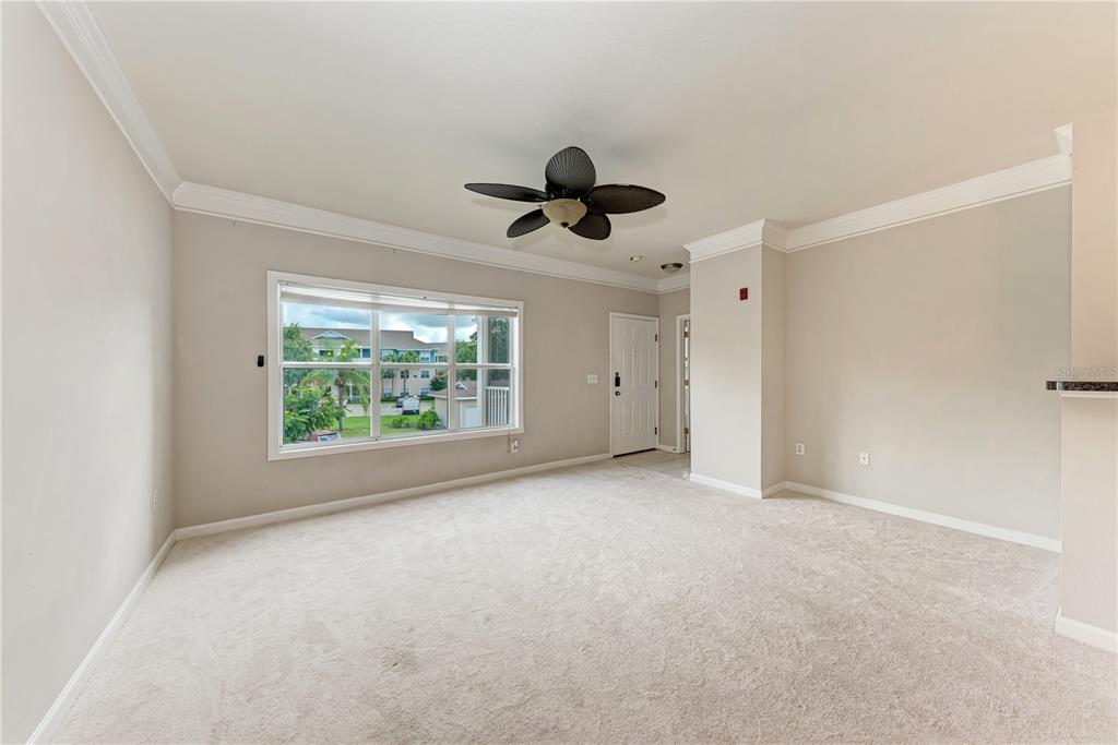 4802 51st Street West, Unit 1122 Bradenton, FL 34210 - Photo 15 of 37 a view of an empty room with a window