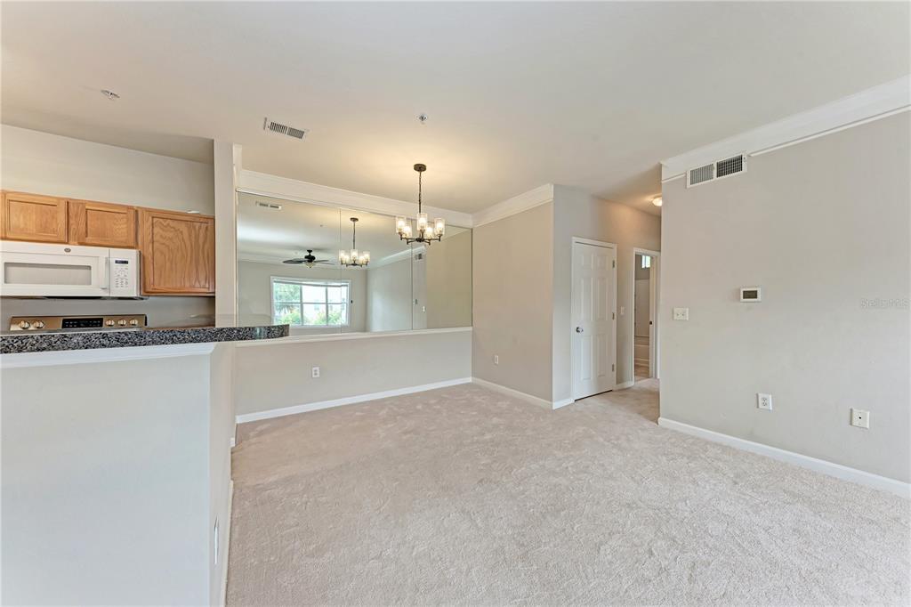 4802 51st Street West, Unit 1122 Bradenton, FL 34210 - Photo 16 of 37 a view of a kitchen with a sink and a refrigerator
