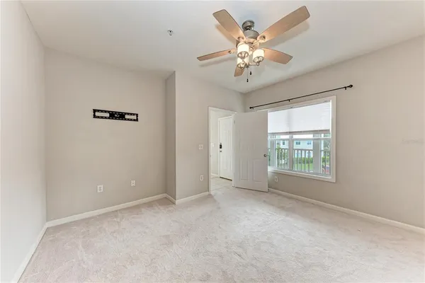 a view of an empty room with a window