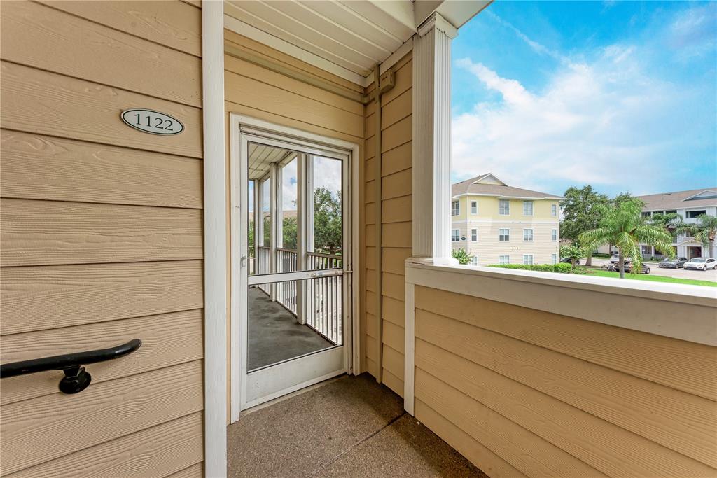 4802 51st Street West, Unit 1122 Bradenton, FL 34210 - Photo 8 of 37 a view of a balcony cabinets and a floor to ceiling window