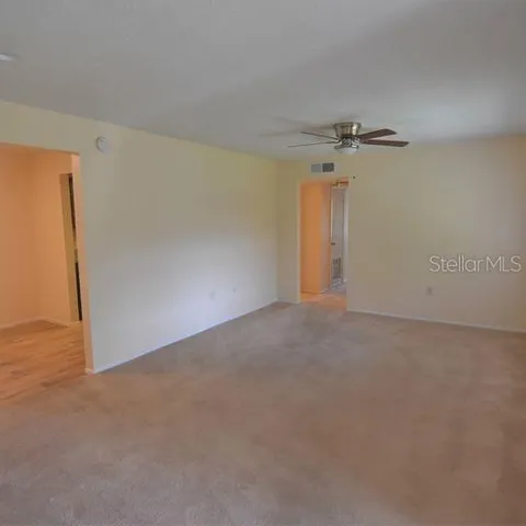 a view of a big room with windows