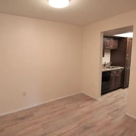 a view of a kitchen with a stove top oven