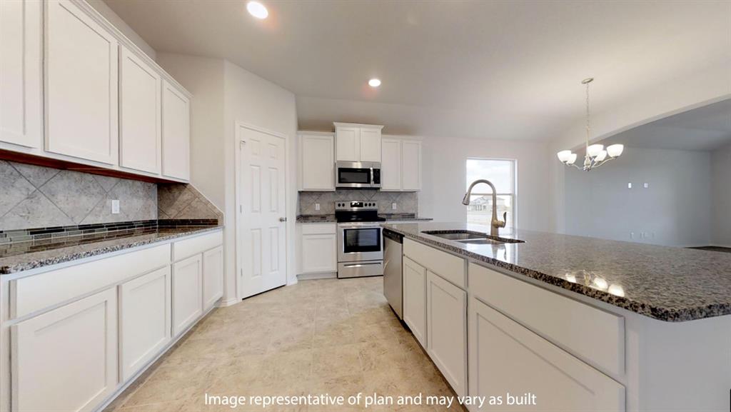 5800 Foggy Lagoon Drive Waco, TX 76708 - Photo 8 of 24 a kitchen with granite countertop white cabinets and stainless steel appliances