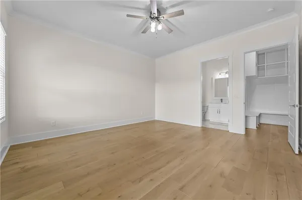 a living room with furniture fireplace and a large window