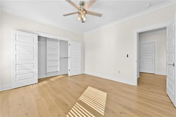 a view of an empty room with a fireplace and a window