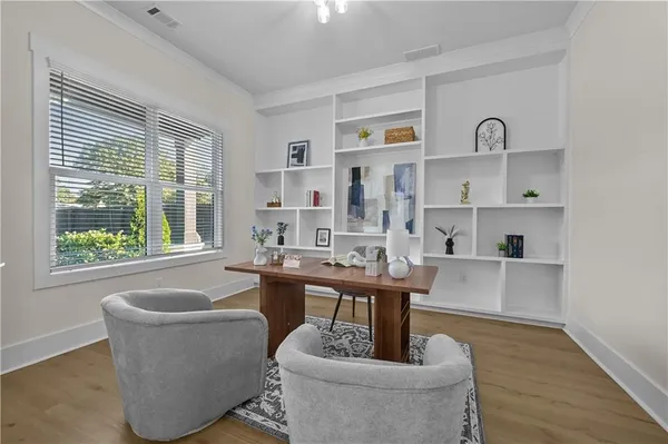 a dining room with furniture and window
