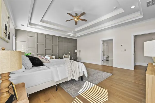 a bathroom with a granite countertop sink a toilet and shower
