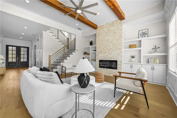 a living room with furniture and a large window