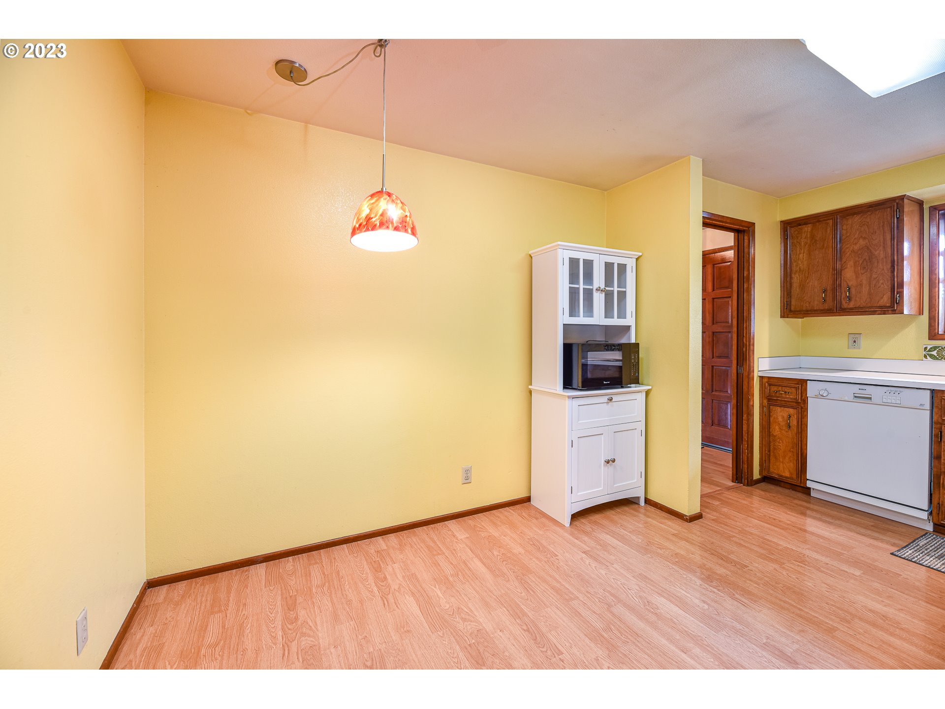 2466 Erin Way Eugene, OR 97408 - Photo 14 of 38 a room with a wooden floor and cabinets