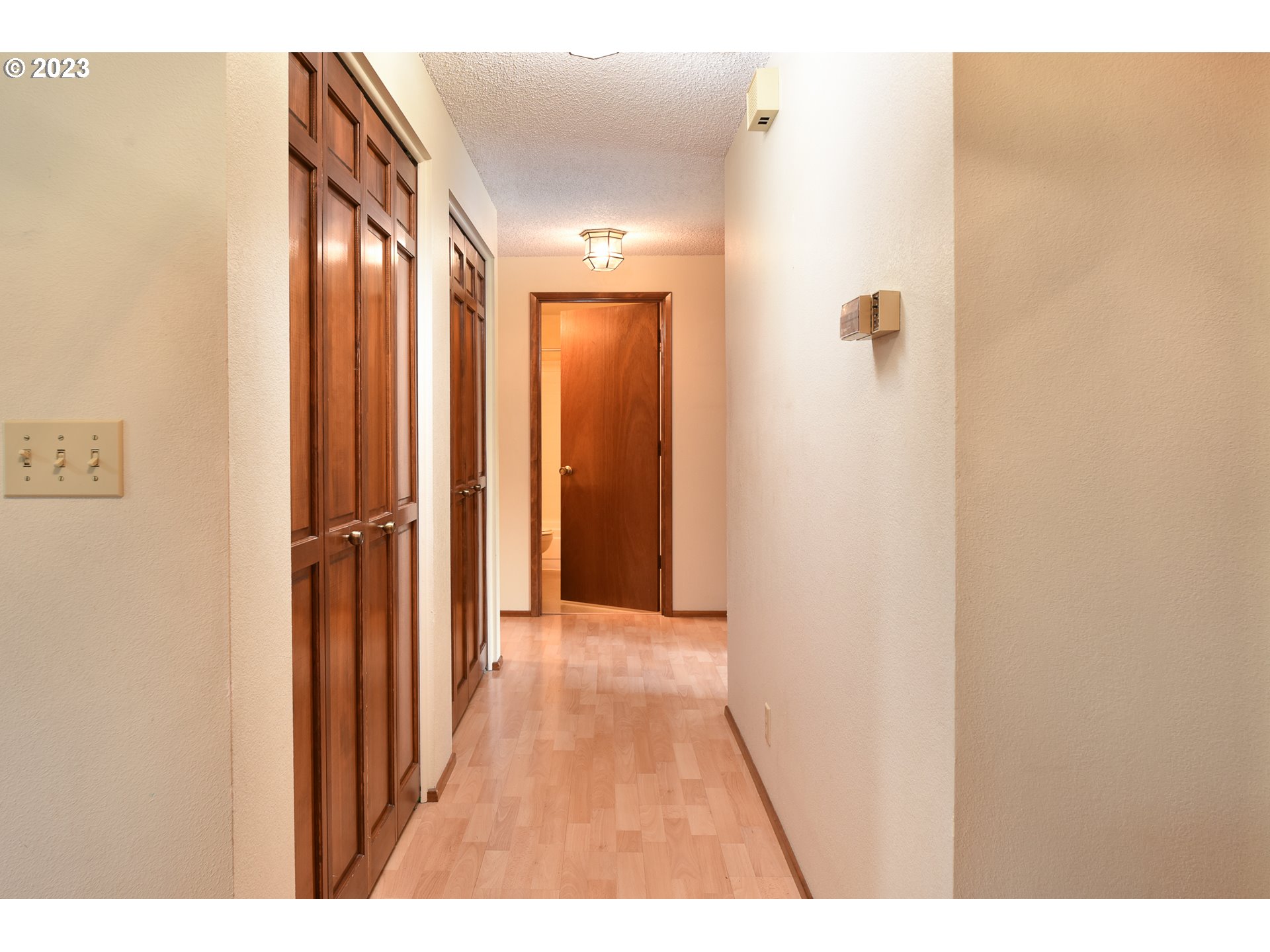 2466 Erin Way Eugene, OR 97408 - Photo 18 of 38 a view of a hallway with wooden floor