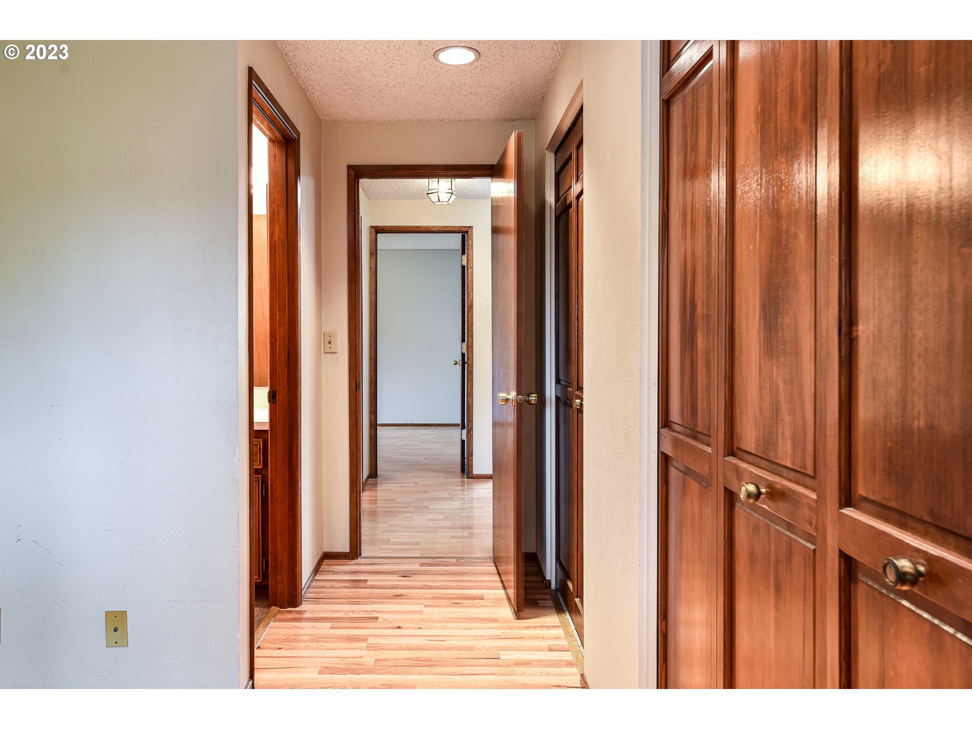 2466 Erin Way Eugene, OR 97408 - Photo 22 of 38 a view of a hallway with wooden floor