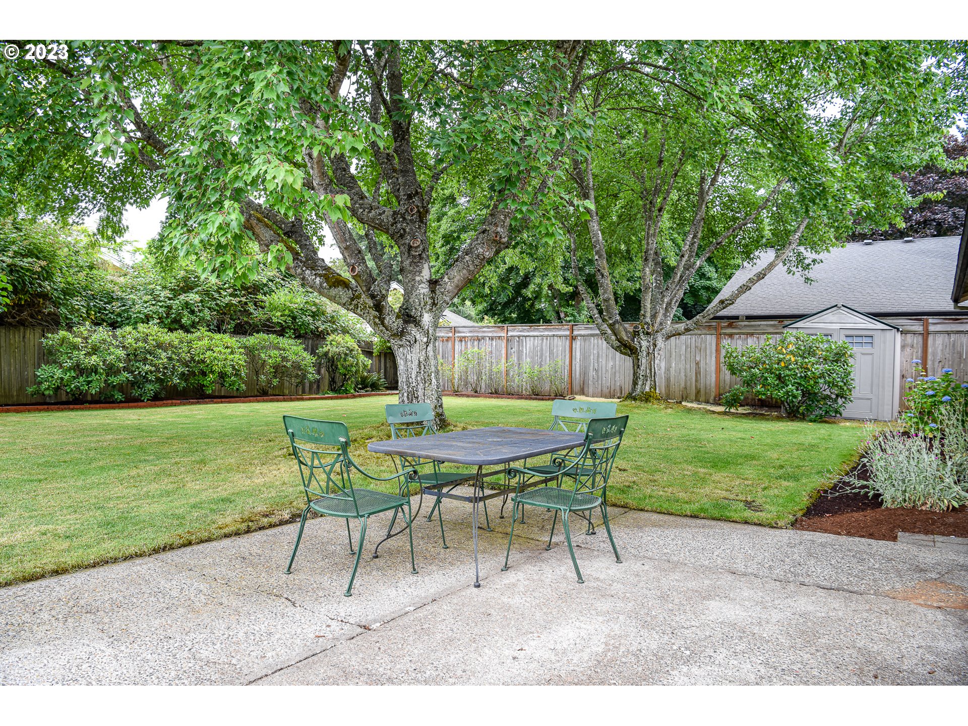 2466 Erin Way Eugene, OR 97408 - Photo 29 of 38 a view of a table and chairs in the garden