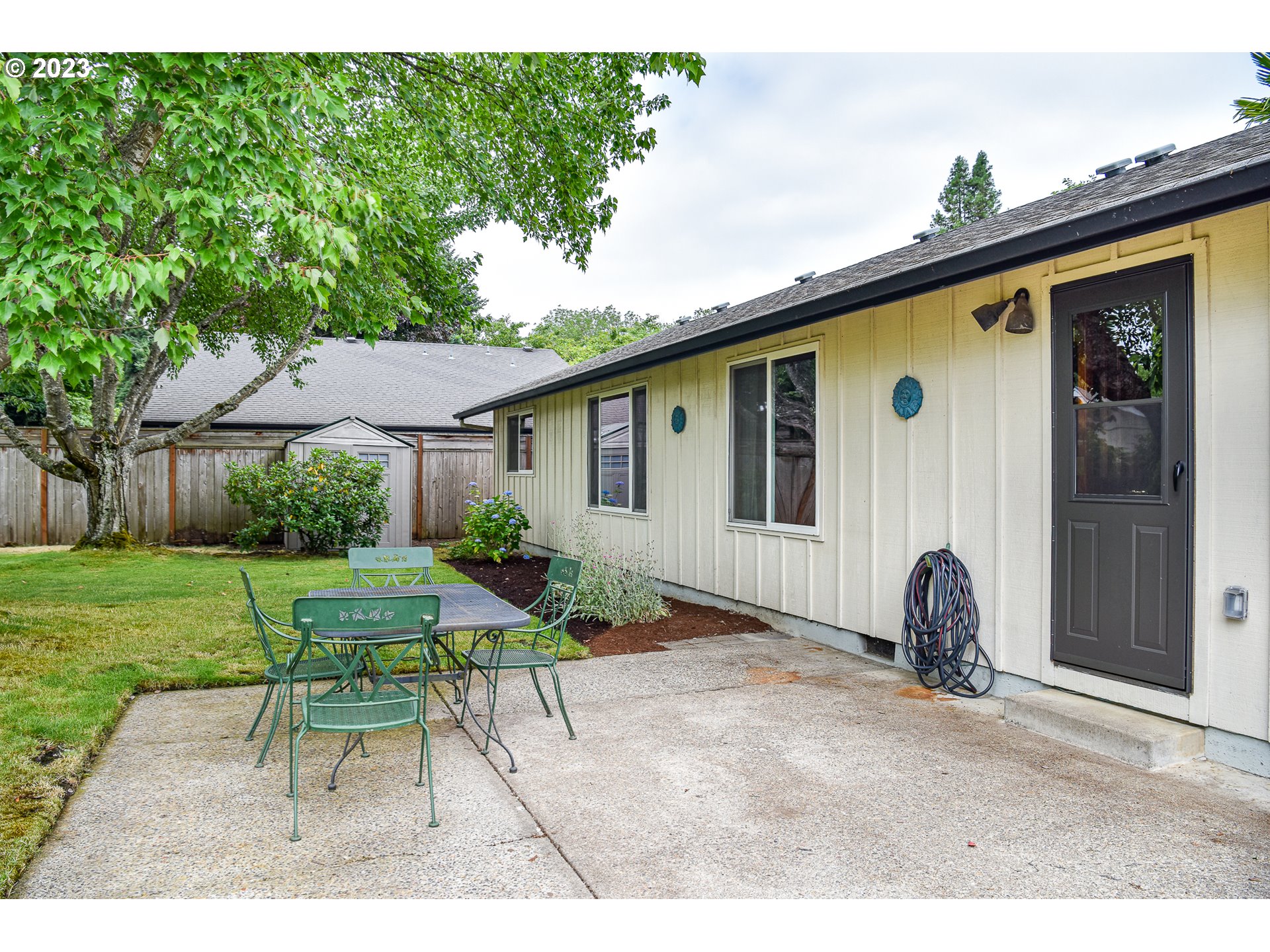 2466 Erin Way Eugene, OR 97408 - Photo 36 of 38 a backyard of a house with table and chairs