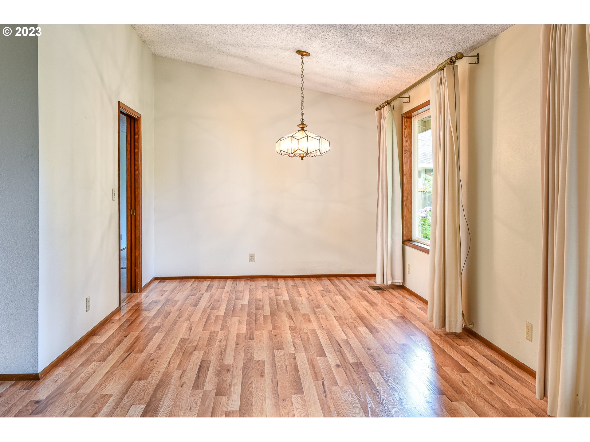 2466 Erin Way Eugene, OR 97408 - Photo 8 of 38 a view of a room with wooden floor and window