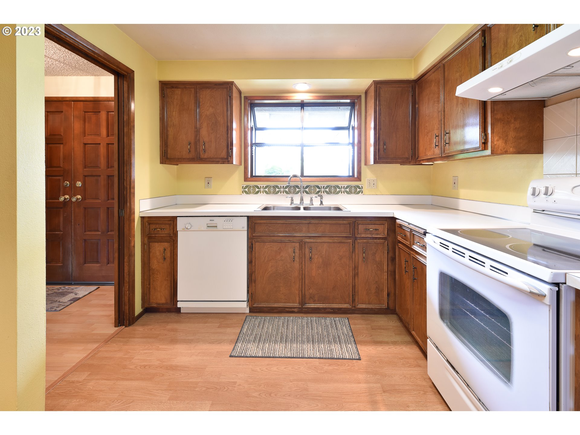 2466 Erin Way Eugene, OR 97408 - Photo 9 of 38 a kitchen with a sink stove and cabinets
