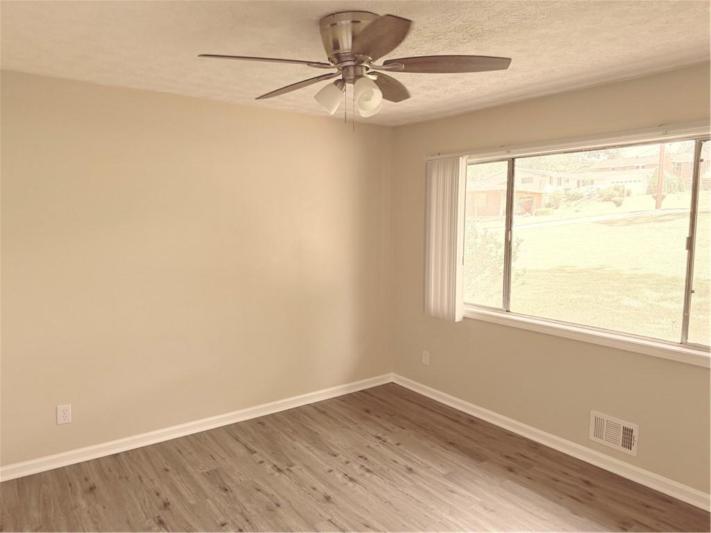 4707 Riverwood Circle Decatur, GA 30035 - Photo 11 of 17 an empty room with a window and a fan