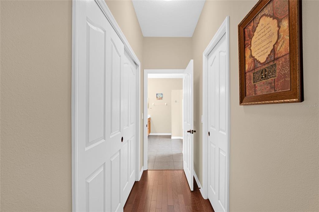 16411 Southwest 14th Avenue Road Ocala, FL 34473 - Photo 14 of 59 a view of a hallway with wooden floor and a door