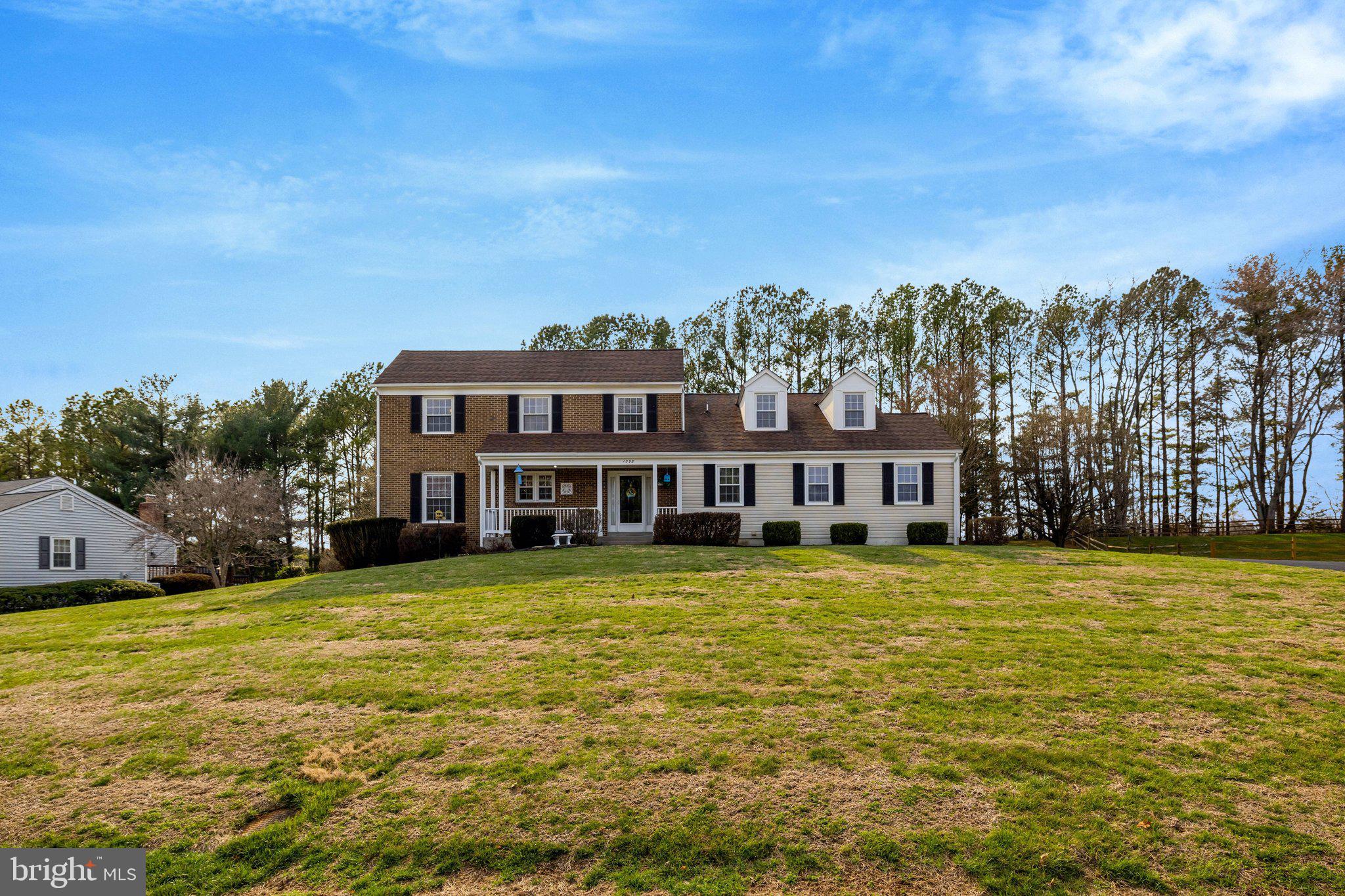 1398 Park Lake Drive Reston, VA 20190 - Photo 2 of 64 a view of a house with a big yard and large trees
