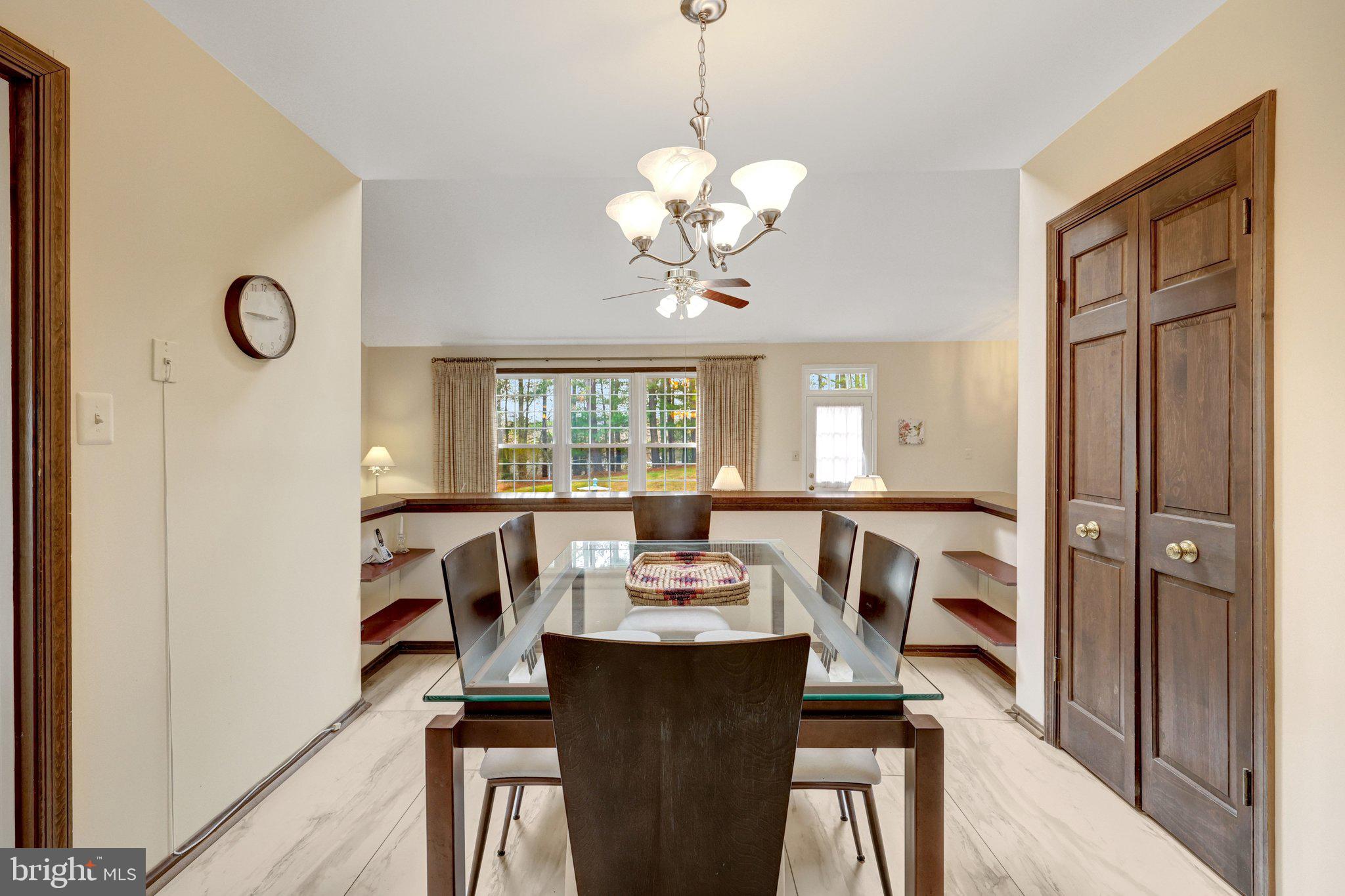 1398 Park Lake Drive Reston, VA 20190 - Photo 24 of 64 a view of a dining room with furniture window and wooden floor