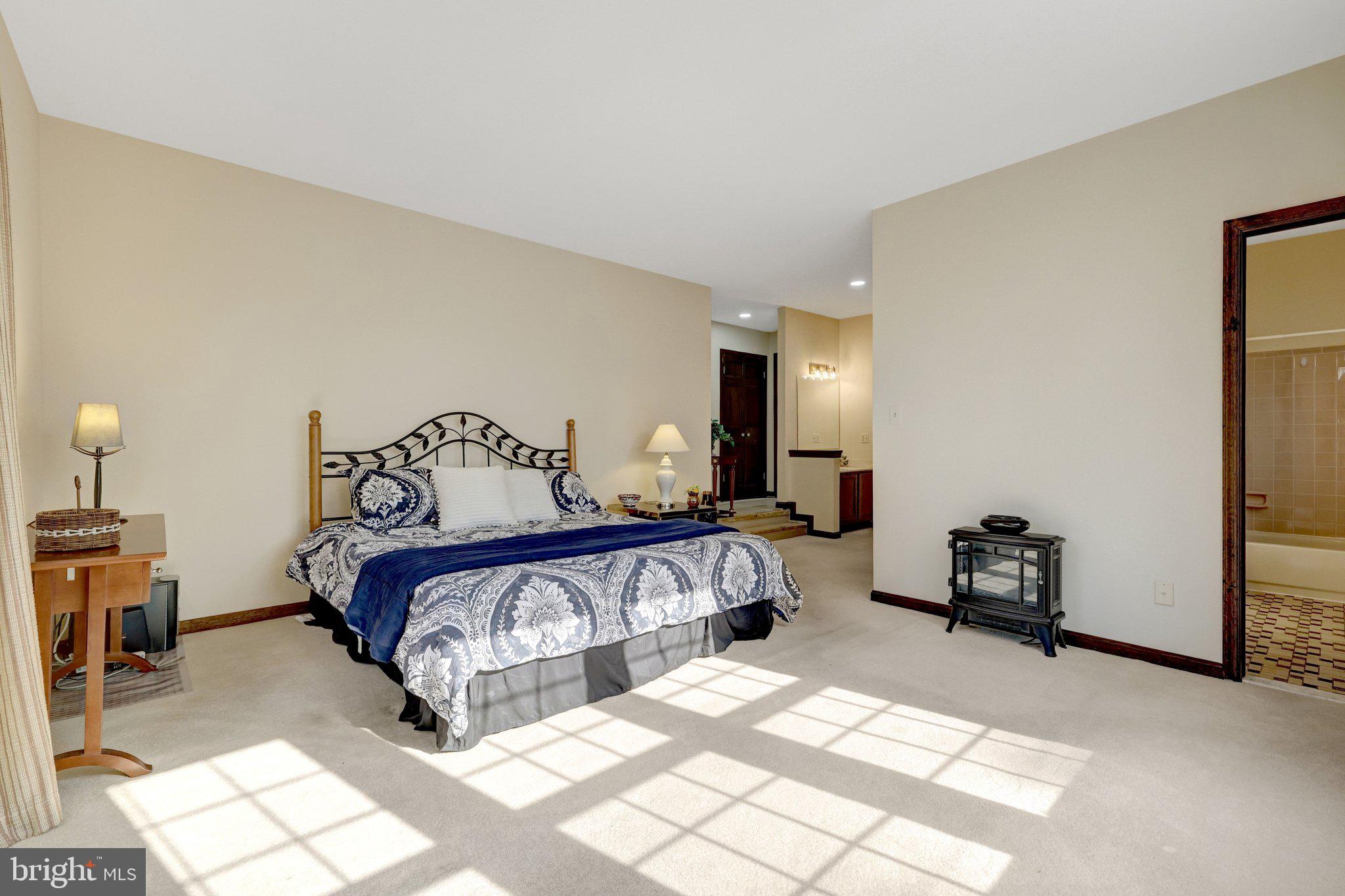 1398 Park Lake Drive Reston, VA 20190 - Photo 29 of 64 a bedroom with a bed and a couch