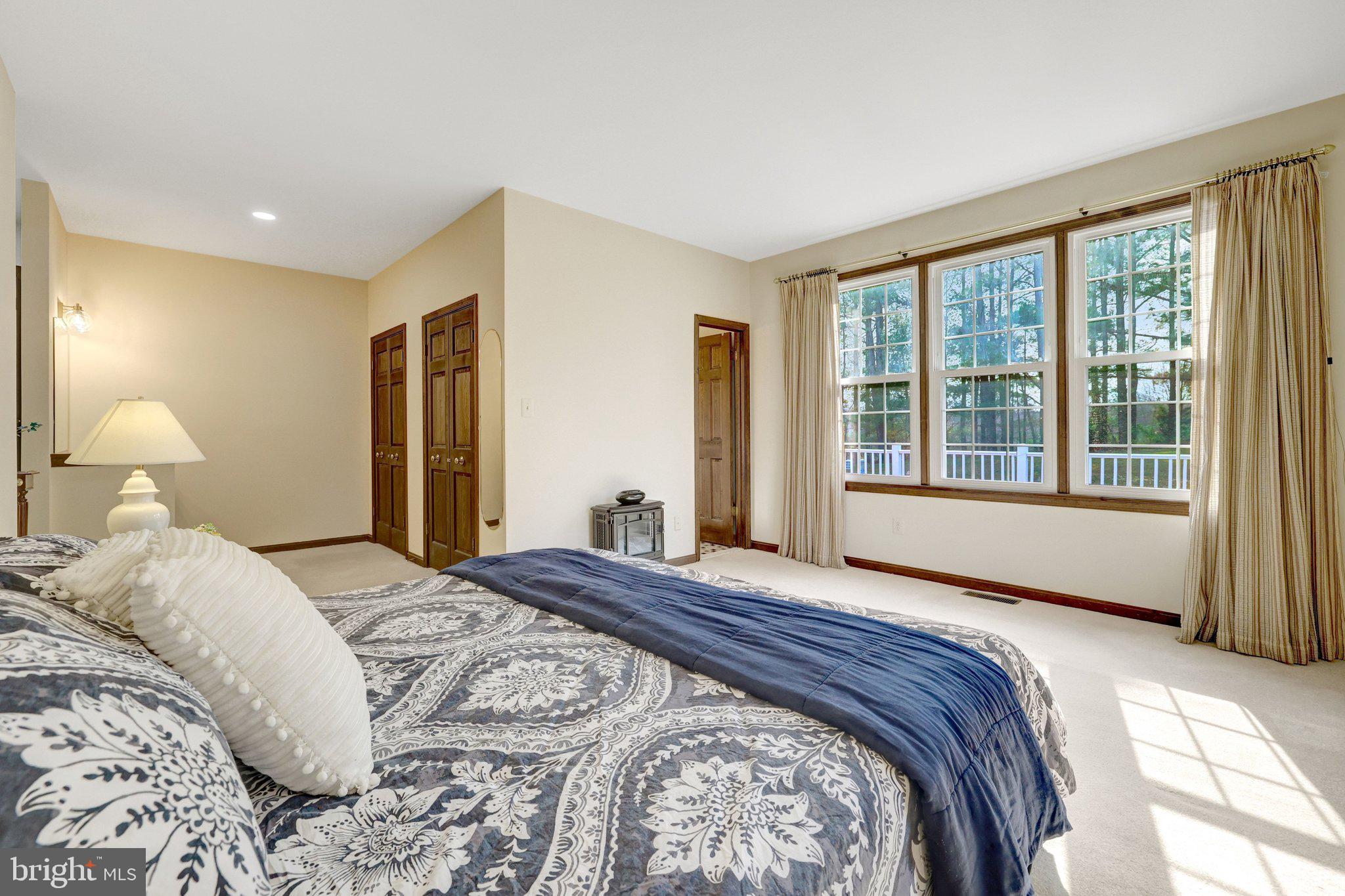 1398 Park Lake Drive Reston, VA 20190 - Photo 30 of 64 a bedroom with a large bed and a large window