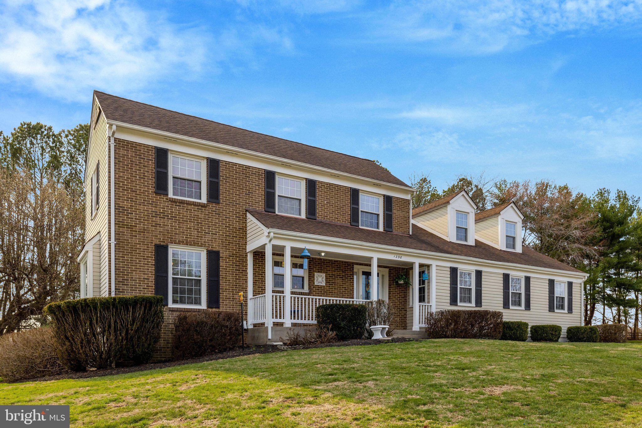1398 Park Lake Drive Reston, VA 20190 - Photo 3 of 64 a front view of a house with a yard