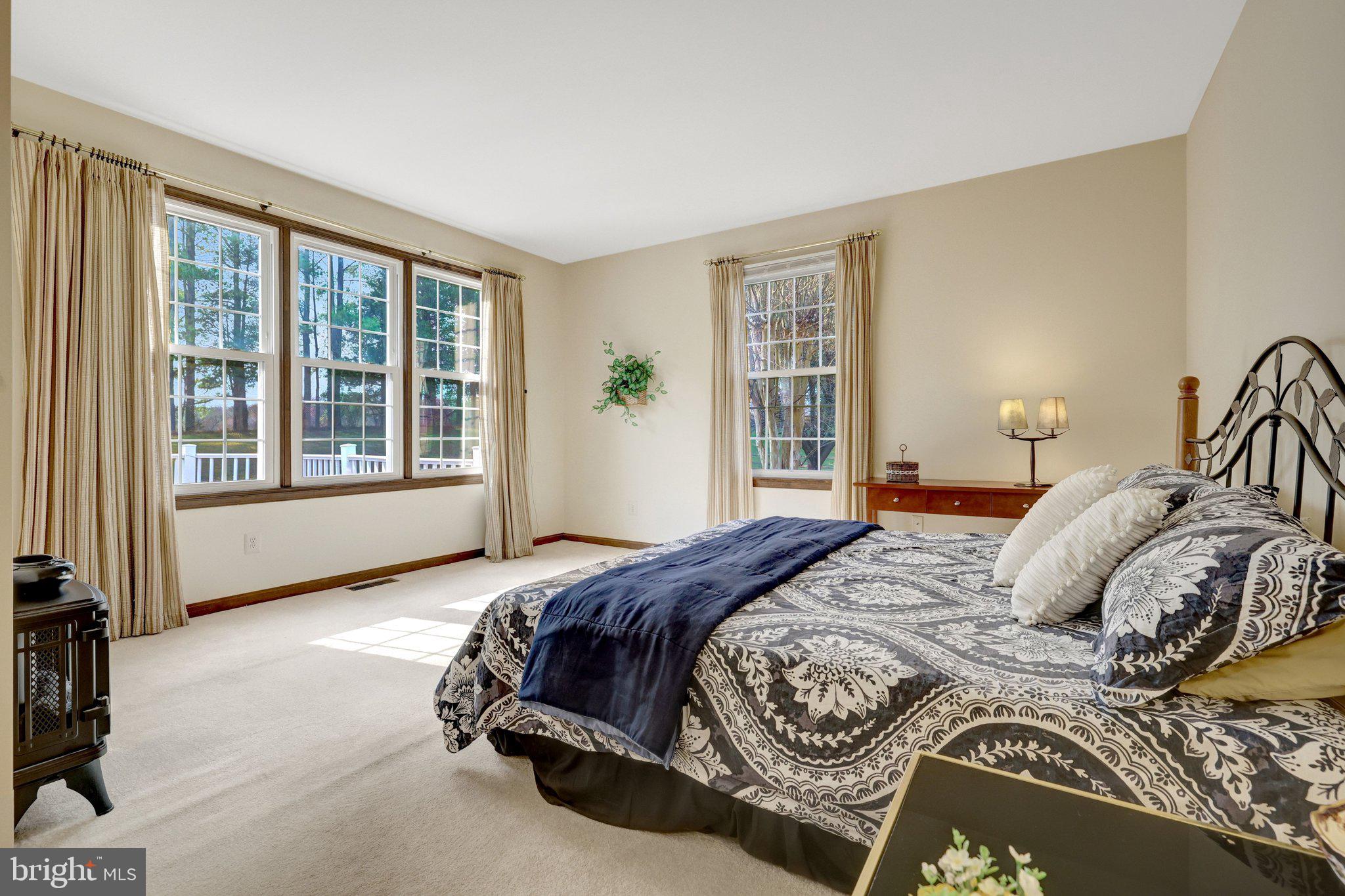 1398 Park Lake Drive Reston, VA 20190 - Photo 31 of 64 a bedroom with a bed and a large window