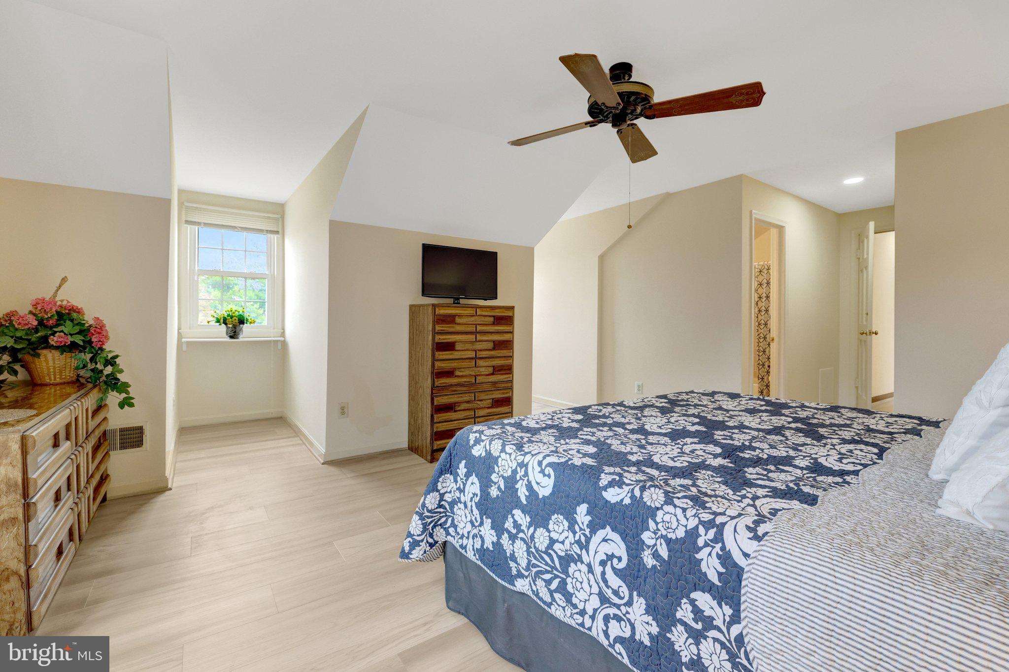 1398 Park Lake Drive Reston, VA 20190 - Photo 34 of 64 a bedroom with a bed and a ceiling fan