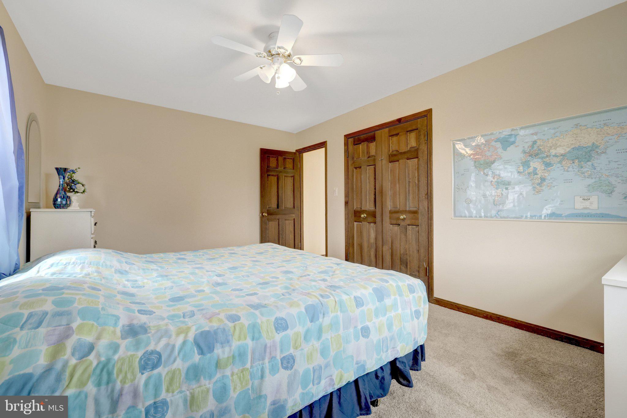 1398 Park Lake Drive Reston, VA 20190 - Photo 36 of 64 a bedroom with a large bed and a chandelier
