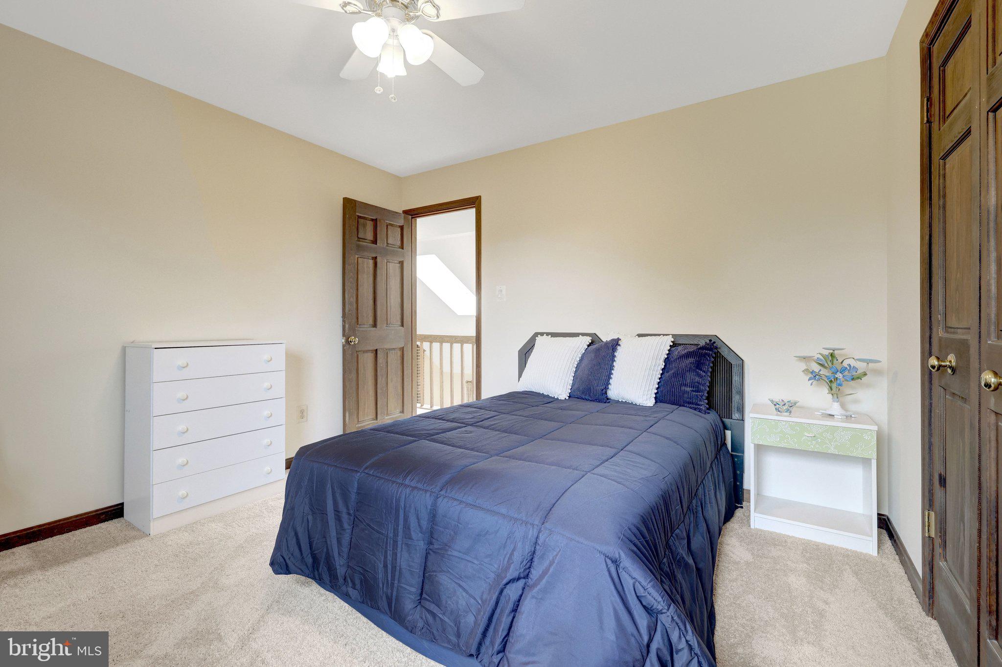 1398 Park Lake Drive Reston, VA 20190 - Photo 37 of 64 a bedroom with a bed and a cabinets