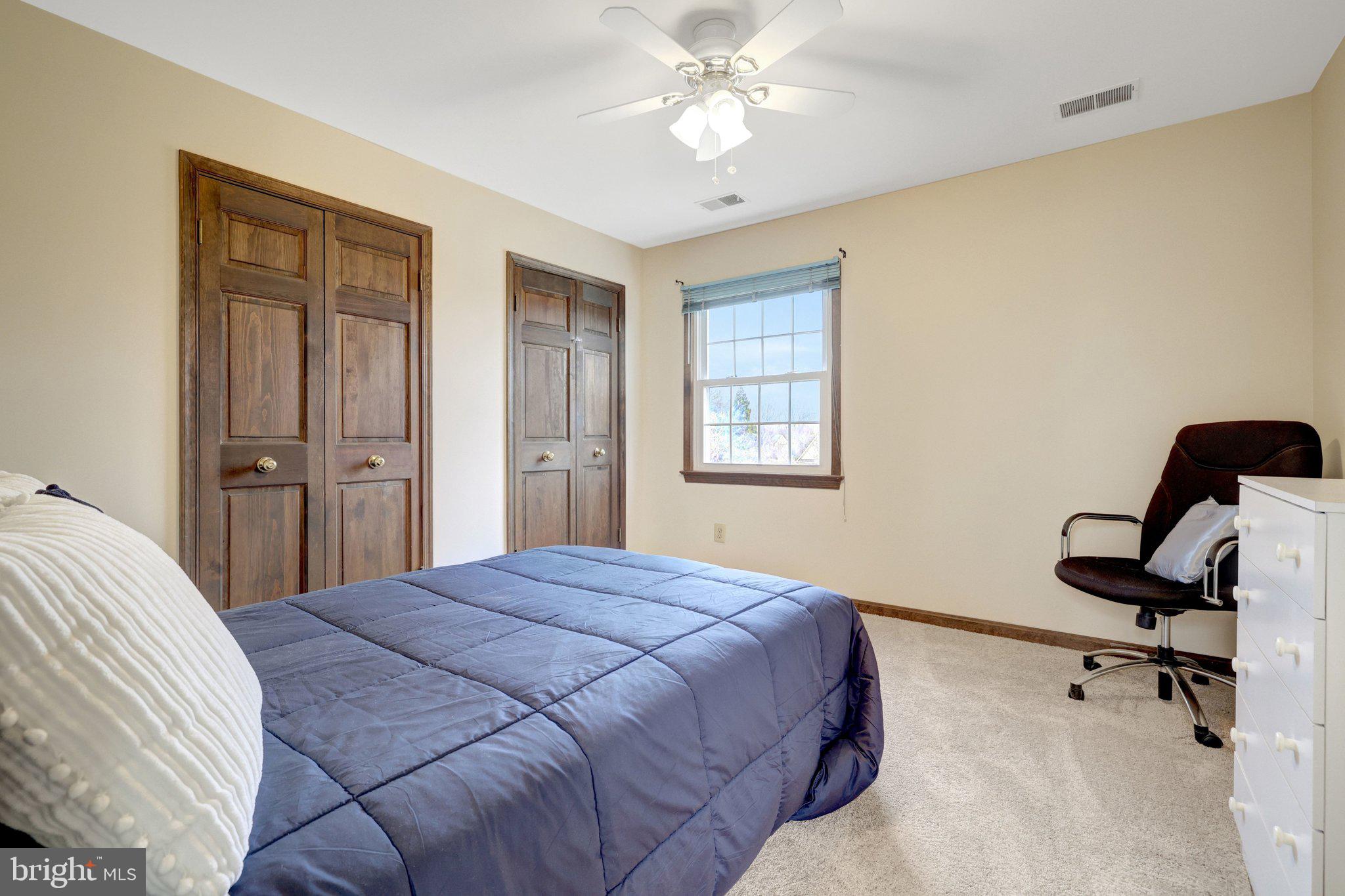 1398 Park Lake Drive Reston, VA 20190 - Photo 38 of 64 a bedroom with a bed and a chandelier
