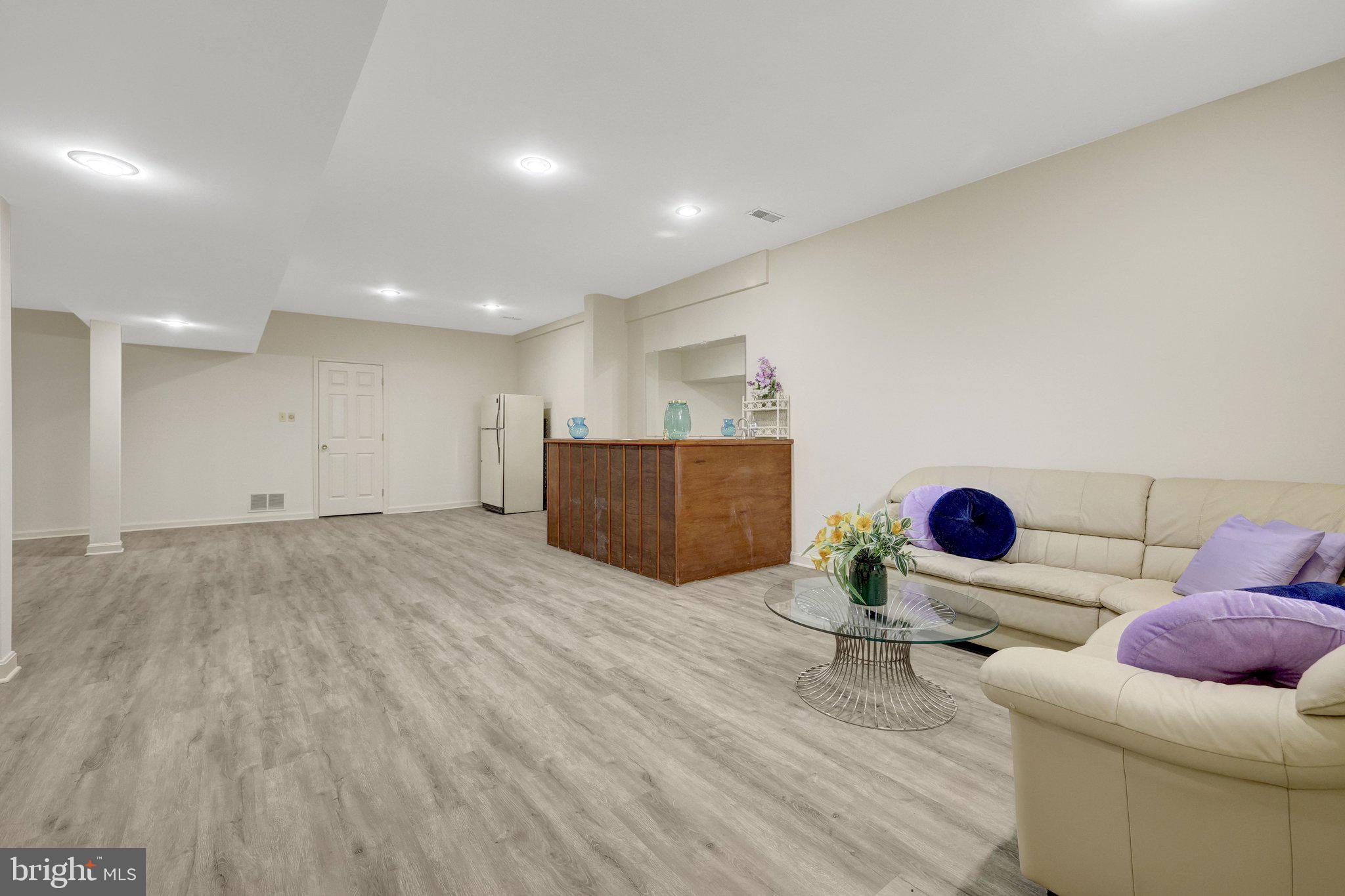 1398 Park Lake Drive Reston, VA 20190 - Photo 42 of 64 a living room with furniture and a wooden floor