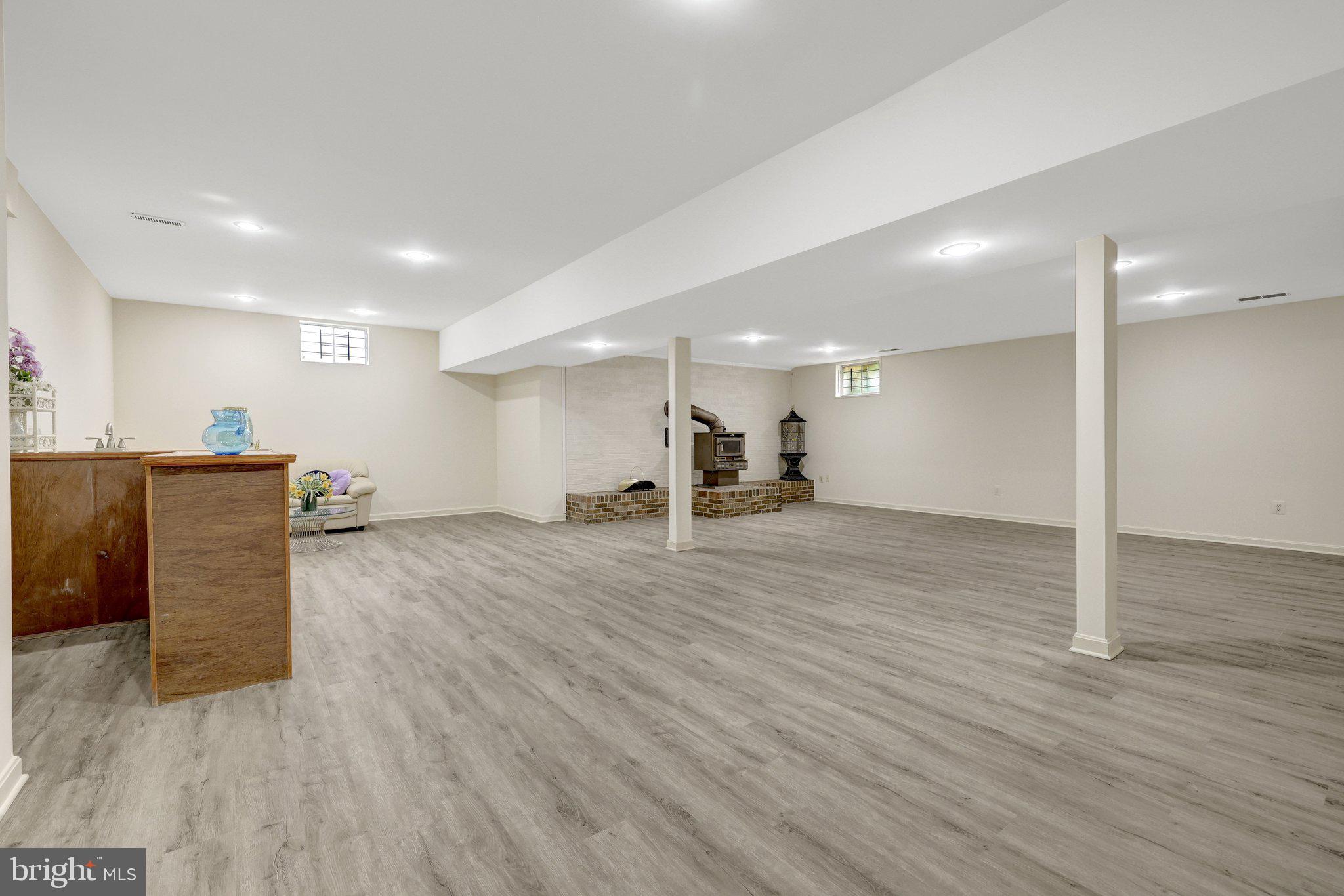 1398 Park Lake Drive Reston, VA 20190 - Photo 44 of 64 a view of a big room with wooden floor and a kitchen