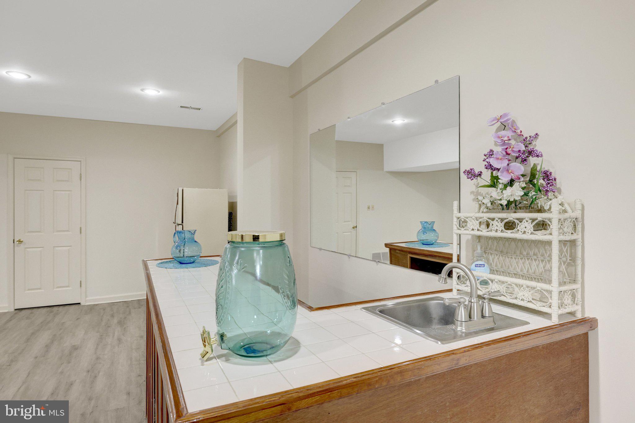 1398 Park Lake Drive Reston, VA 20190 - Photo 47 of 64 a kitchen with a sink and a refrigerator