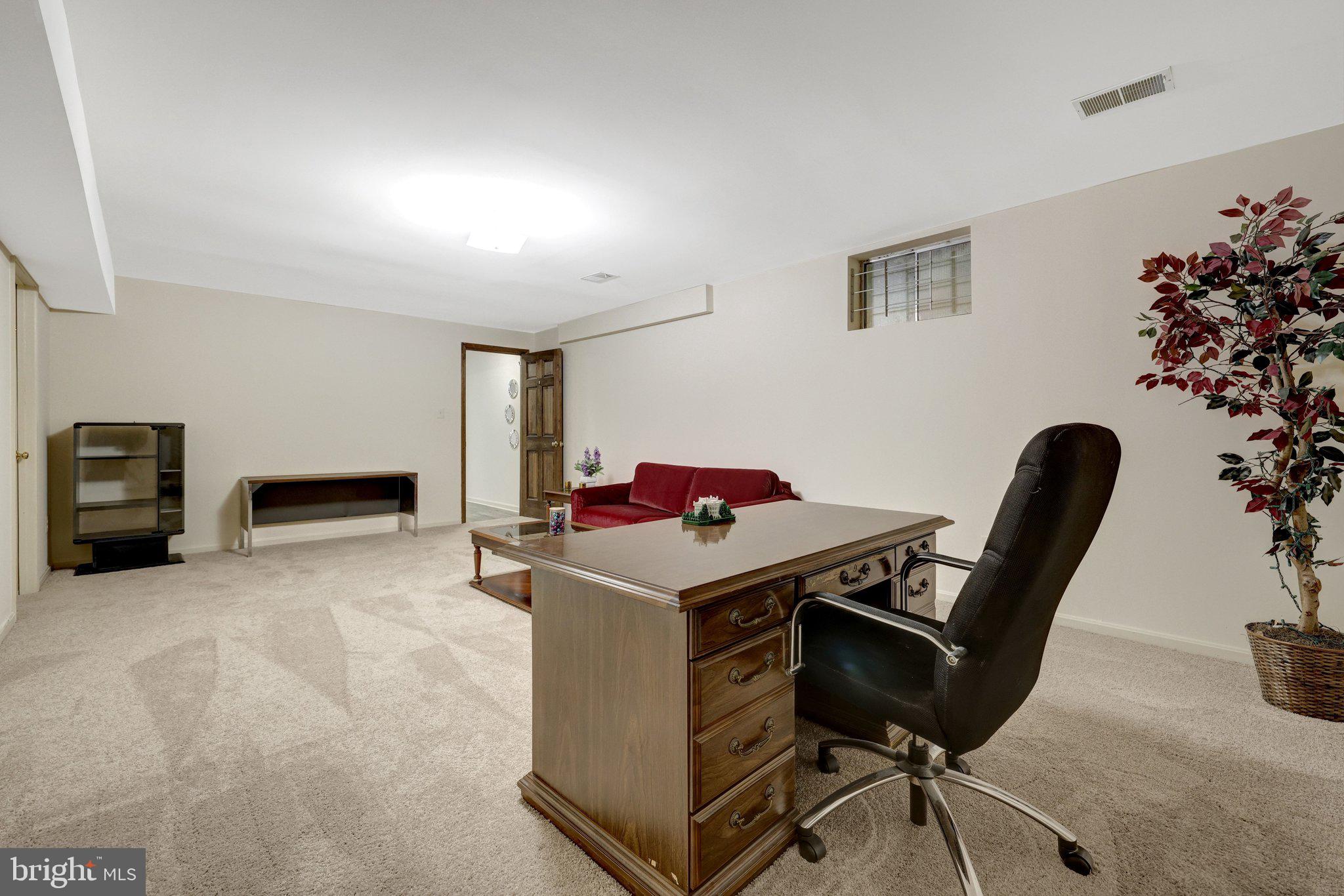 1398 Park Lake Drive Reston, VA 20190 - Photo 48 of 64 a utility room with furniture and flowers