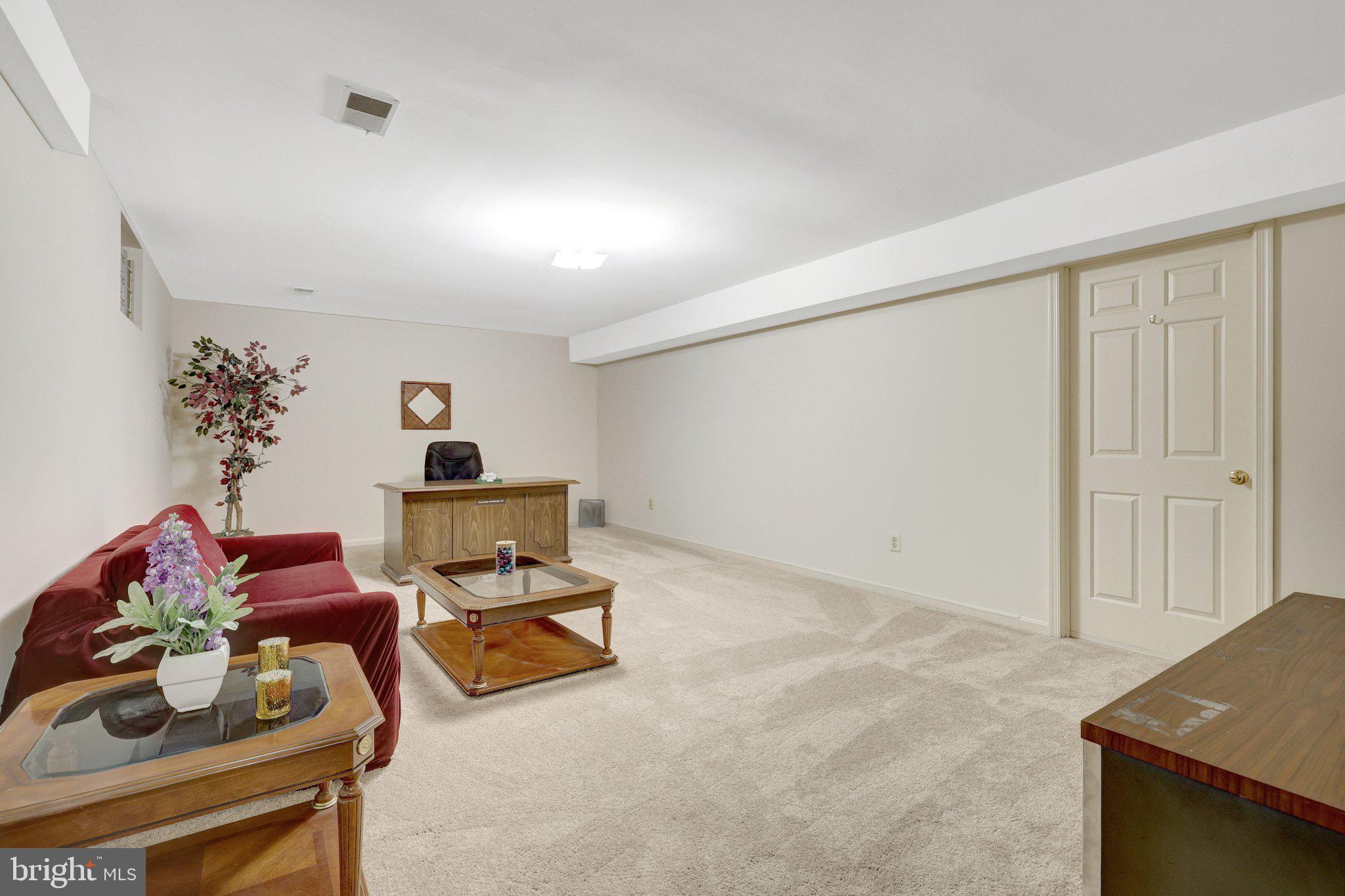 1398 Park Lake Drive Reston, VA 20190 - Photo 49 of 64 a living room with furniture and a window